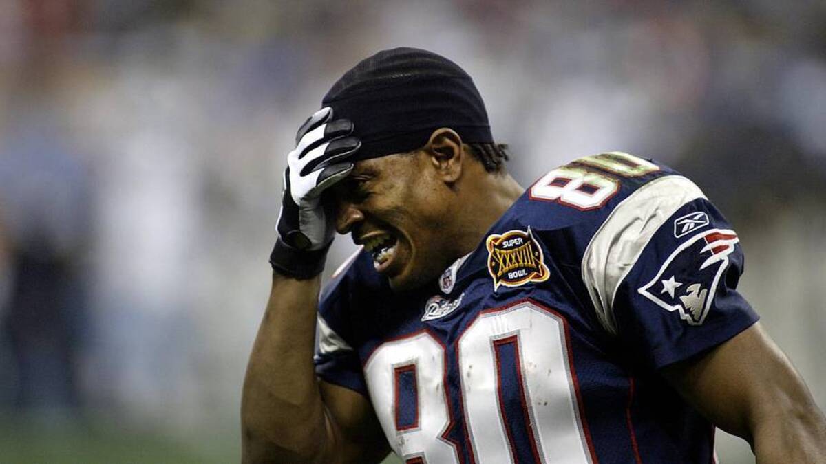  Feb 1, 2004; Houston, TX, USA; FILE PHOTO; New England Patriots receiver Troy Brown (80) reacts after a play against the Carolina Panthers during Super Bowl XXXVIII at Reliant Stadium. The Patriots defeated the Panthers 32-29. Mandatory Credit: MPS-Imagn Images | MPS-Imagn Images 