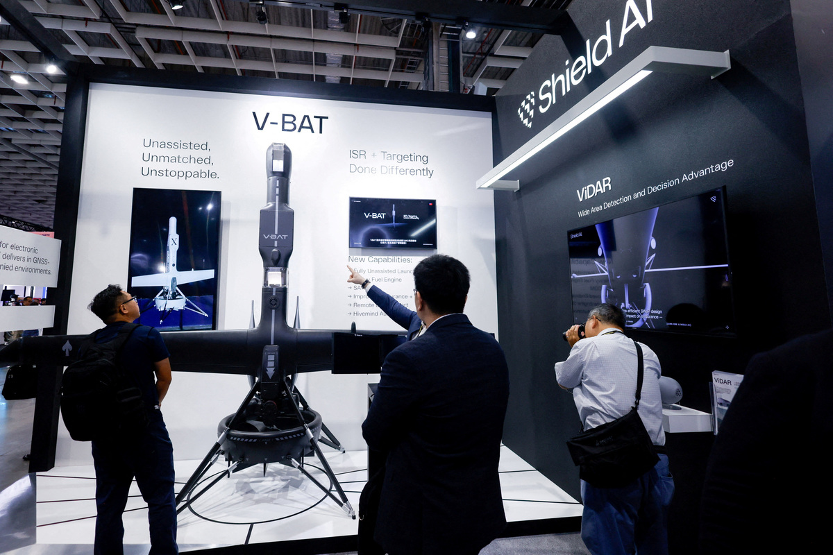 FILE PHOTO: Visitors look at Shield AI’s V-BAT unmanned aerial vehicle on display during the Taipei Aerospace and Defence Technology Exhibition in Taipei, Taiwan, September 18, 2025. REUTERS/Ann Wang/File Photo