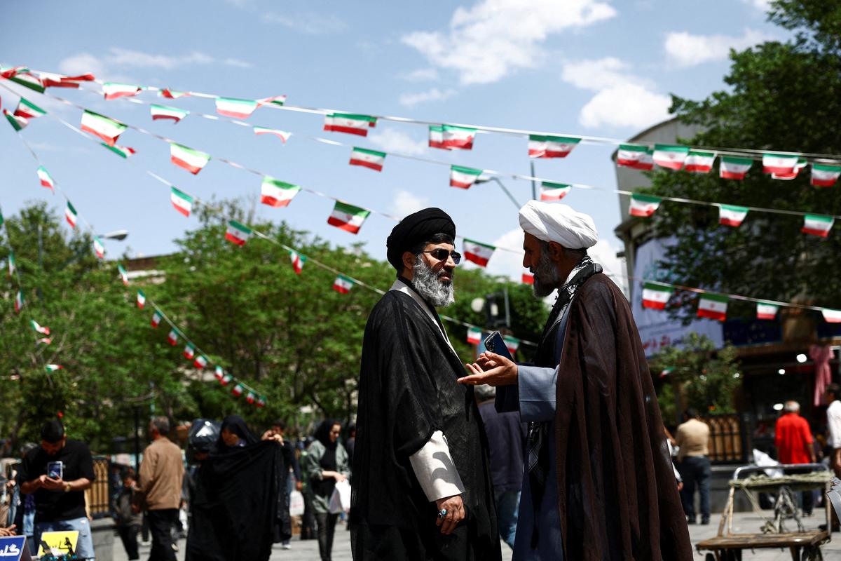 Iranian clerics speak in Tehran Bazaar, amid a ceasefire between U.S. and Iran, in Tehran, Iran, April 21, 2026. Majid Asgaripour/WANA (West Asia News Agency) via REUTERS