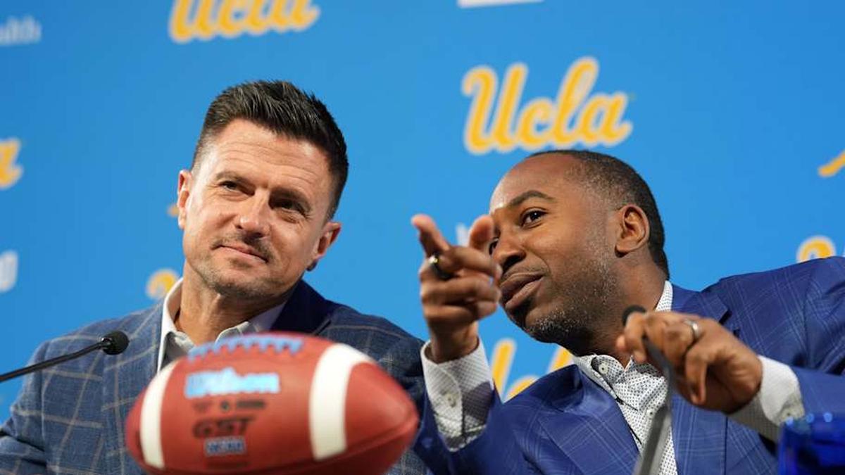  Dec 9, 2025; Los Angeles, CA, USA; UCLA Bruins football coach Bob Chesney (left) and athletic director Martin Jarmond at introductory press conference at Renee Luskin Conference Center Centennial Ballroom. Mandatory Credit: Kirby Lee-Imagn Images | Kirby Lee-Imagn Images 