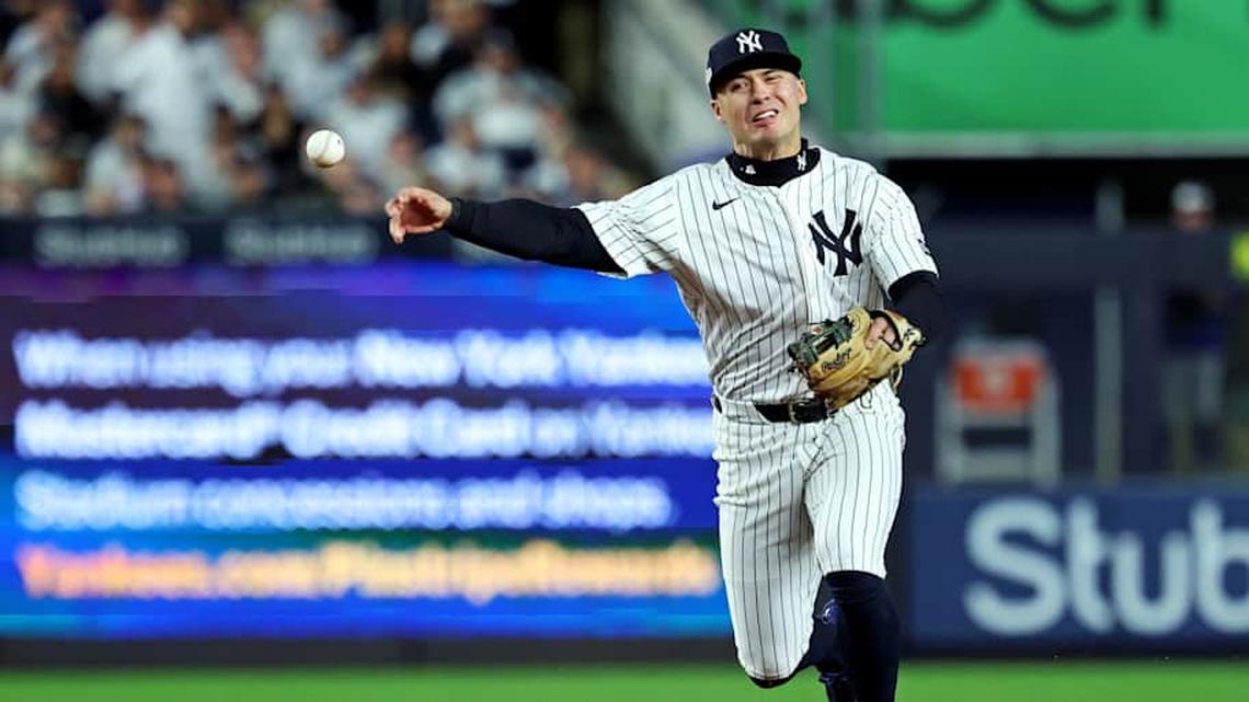  Oct 8, 2025; Bronx, New York, USA; New York Yankees shortstop Anthony Volpe (11) throws to first base for an out during the third inning against the Toronto Blue Jays during game four of the ALDS round for the 2025 MLB playoffs at Yankee Stadium. | Vincent Carchietta-Imagn Images 