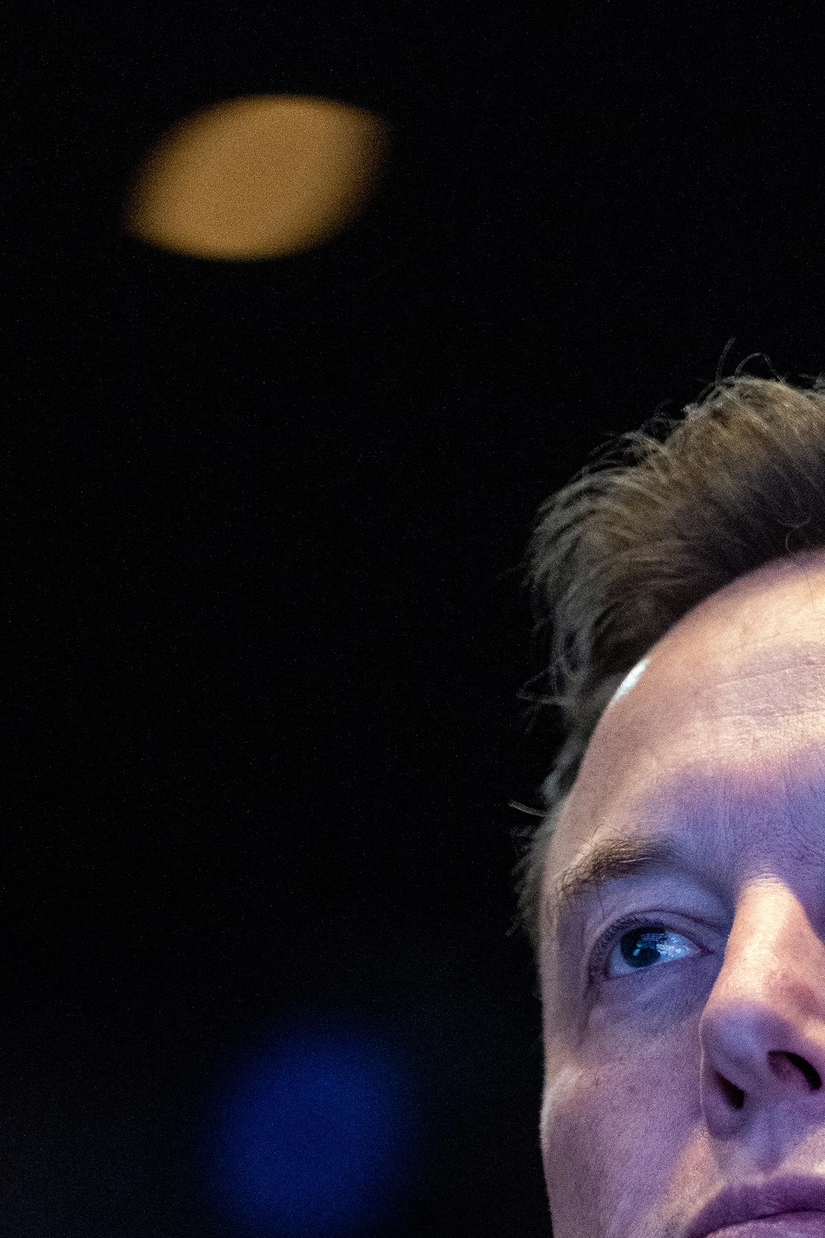 FILE -- Elon Musk listens as President Donald Trump delivers remarks at a Saudi Arabia Investment forum at the Kennedy Center in Washington, Nov. 19, 2025. Musk's legal team will start arguing his case against OpenAI on April 28, in a blockbuster trial that could reshape one of the industry's most important companies and shift the course of the artificial intelligence race. (Haiyun Jiang/The New York Times)