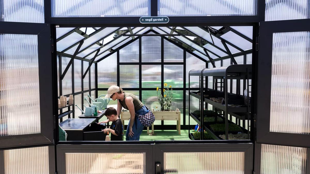 Visitors walk through a greenhouse at the museum’s agriculture area. (Myung J. Chun/Los Angeles Times/TNS)