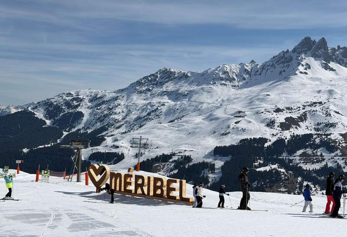  The Méribel sign on the slopes says it all - this is the heart of Les 3 Vallées, where families stop for photos and the mountain keeps going in every direction. Photo credit: Liana Moore 