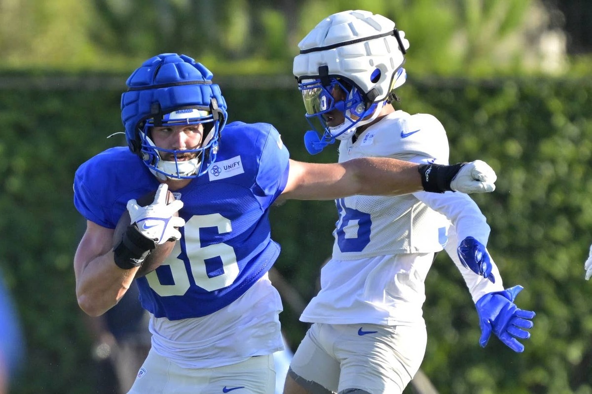  Jul 29, 2024; Los Angeles, CA, USA; Los Angeles Rams tight end Colby Parkinson (86) rums past cornerback Charles Woods (36) after a complete pass during training camp at Loyola Marymount University. Jayne Kamin-Oncea-Imagn Images Jayne Kamin-Oncea-Imagn Images