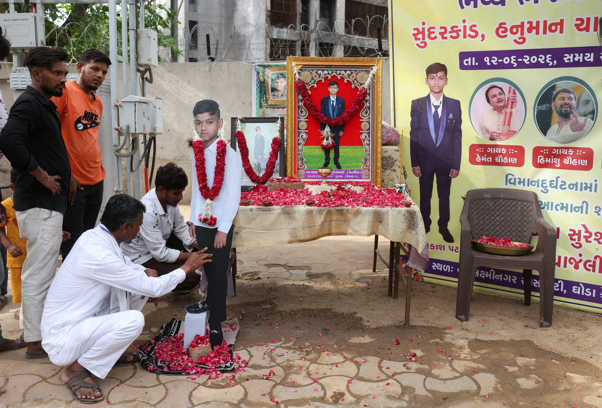 People setup a cut out of Akash Patni, 14, who died in an Air India Boeing 787-8 Dreamliner crash on June 12, 2025, near the crash site during the first anniversary in Ahmedabad, India, June 12, 2026. REUTERS/Amit Dave