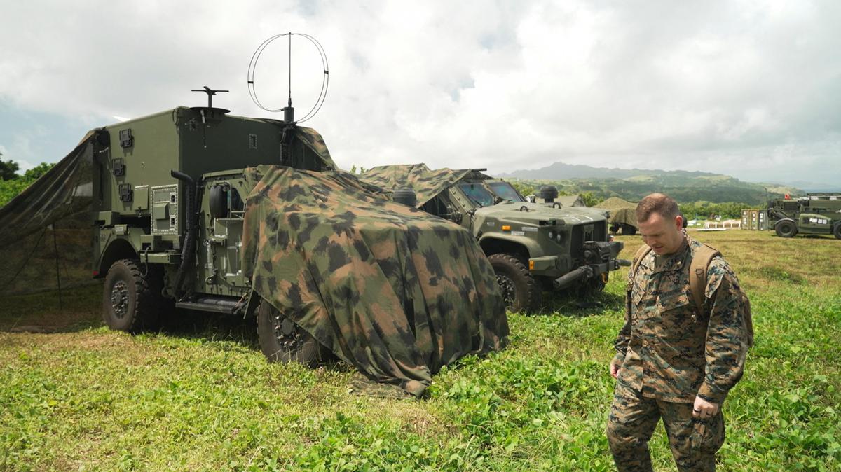 A member of the U.S. military walks near vehicles and equipment used for the Navy-Marine Expeditionary Ship Interdiction System (NMESIS) anti-ship missile system during joint military exercises in Basco, Batanes province, Philippines, May 2, 2026. REUTERS/Adrian Portugal