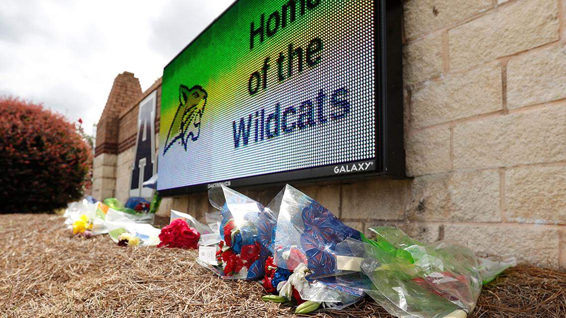 Flowers lay at the Apalachee High School’s main entrance sign in Winder, Ga., on Thursday, Sept. 5, 2024, a day after a shooting left four people dead and nine others wounded.