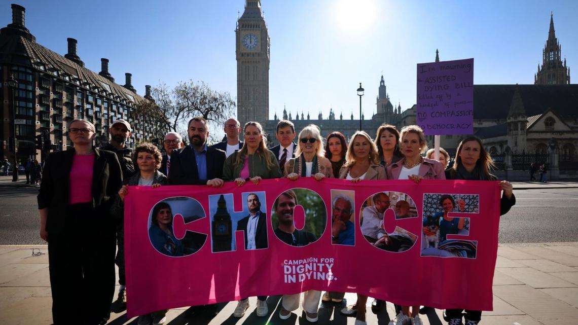 Members of the non-profit Dignity in Dying campaign group protest outside Parliament in London on Friday where the House the Lords was holding its final debate on an assisted-dying bill before it runs out the clock in the legislative timetable of the current session of parliament, which is due to end next week.