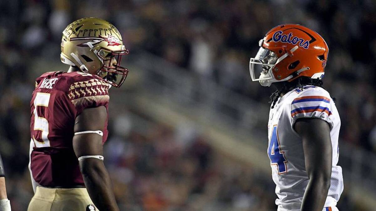  Nov 25, 2022; Tallahassee, Florida, USA; Florida State Seminoles defensive end Jared Verse (5) and Florida Gators linebacker Chief Borders (14) exchange words during the first half at Doak S. Campbell Stadium. Mandatory Credit: Melina Myers-Imagn Images | Melina Myers-Imagn Images 