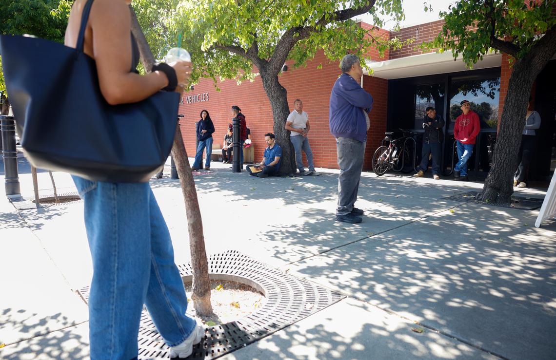 People wait in front of the DMV in San Jose, Calif., on Friday, April 11, 2025. (Shae Hammond/Bay Area News Group)
