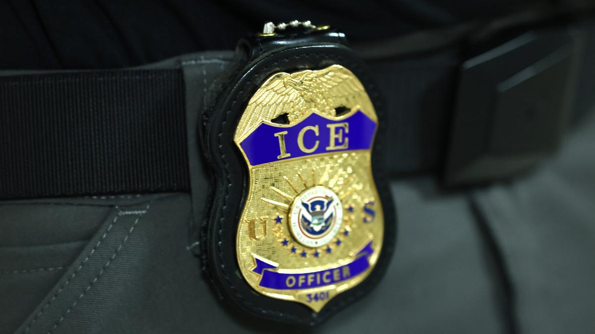The badge of an  Immigration and Customs Enforcement (ICE) agent is seen as they patrol the halls of immigration court at the Jacob K. Javits Federal Building on June 9, 2025 in New York City. (Michael M. Santiago/Getty Images/TNS)