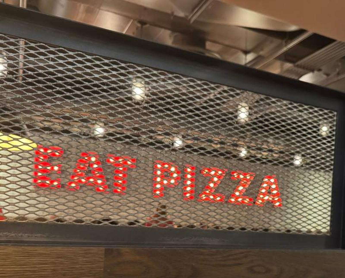  The sign said "Eat Pizza," so naturally we did, digging into a classic Chicago deep dish at Giordano's. Photo credit: Emily Molina 