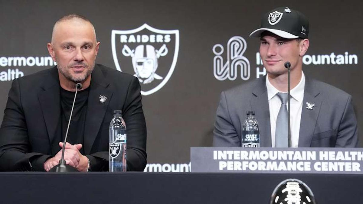  Apr 24, 2026; Henderson, NV, USA; Las Vegas Raiders quarterback Fernando Mendoza (right) and general manager John Spytek at introductory press conference at Intermountain Health Performance Center after being selected as the No. 1 pick in the 2026 NFL Draft. Mandatory Credit: Kirby Lee-Imagn Images | Kirby Lee-Imagn Images 