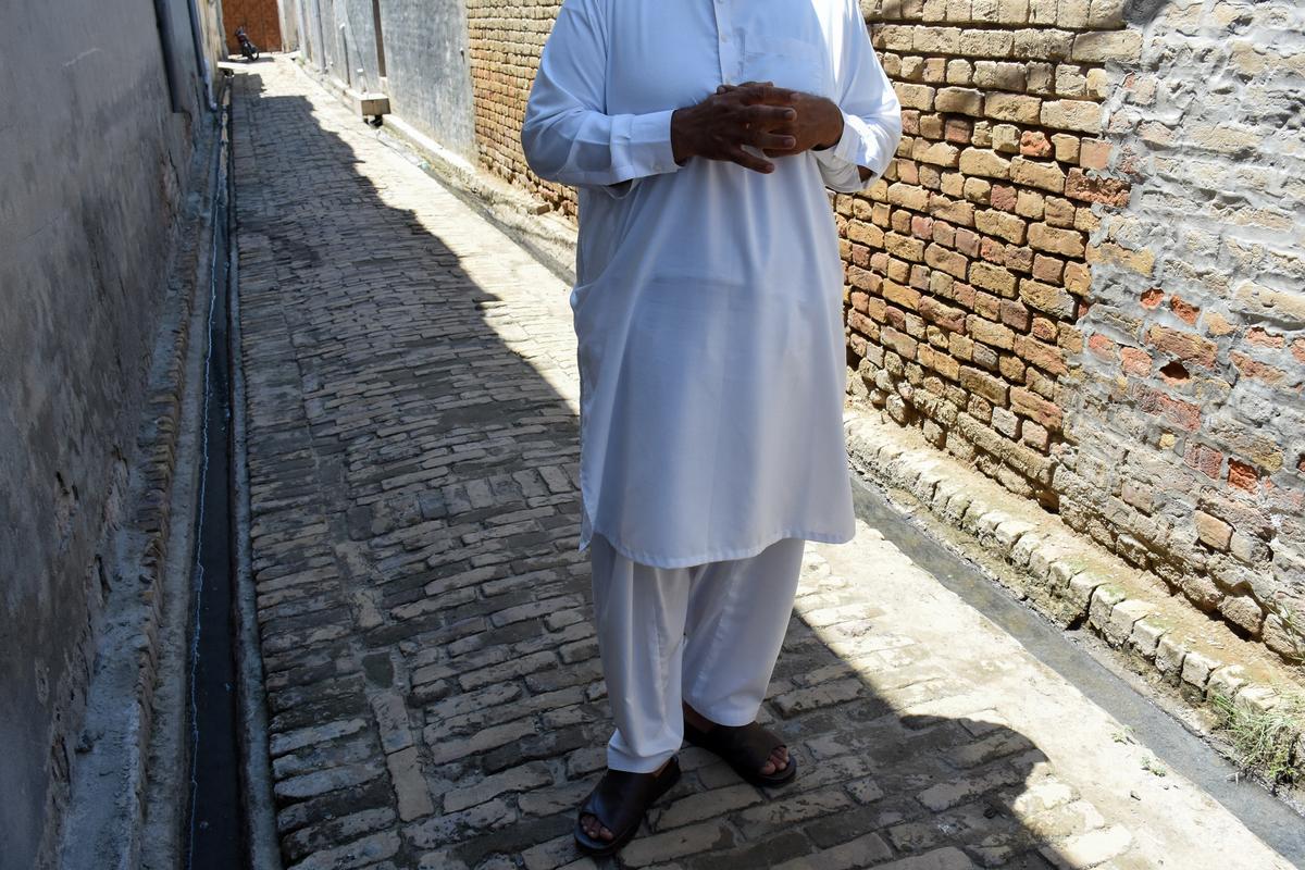 A Pakistani Shi'ite Muslim man, who was working as a driver in the United Arab Emirates, speaks with Reuters at his village, after being deported along with many others following the U.S.-Israeli war against Iran, in Chakwal, Pakistan May 5, 2026. REUTERS/Waseem Khan