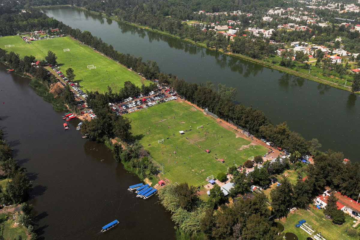 A drone view shows chinampas, farms built on man-made floating islands, some transformed into soccer pitches in Cuemanco, which is one of the habitats of the endangered axolotl, a salamander native to central Mexico's lakes, as axolotl's use in public imagery ahead of the FIFA World Cup 2026 has divided residents who say more should be done to protect its habitat, in Xochimilco, Mexico City, Mexico, May 16, 2026. REUTERS/Raquel Cunha
