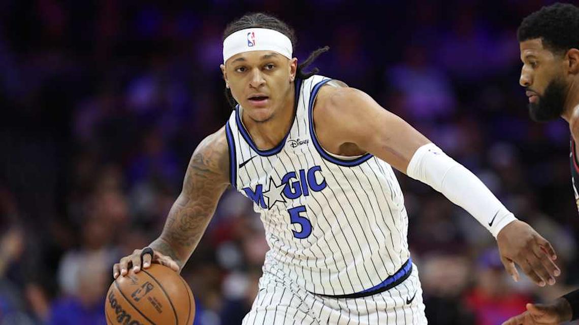  Apr 15, 2026; Philadelphia, Pennsylvania, USA; Orlando Magic forward Paolo Banchero (5) controls the ball against the Philadelphia 76ers during the first quarter during the play-in rounds of the 2026 NBA Playoffs at Xfinity Mobile Arena. | Bill Streicher-Imagn Images 