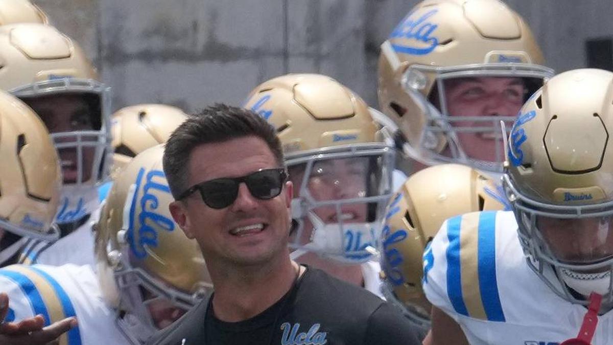  May 2, 2026; Pasadena, CA, USA; UCLA Bruins coach Bob Chesney and women's basketball coach Cori Close lead players onto the field during the spring game at Rose Bowl. Mandatory Credit: Kirby Lee-Imagn Images | Kirby Lee-Imagn Images 