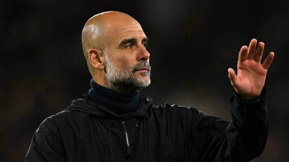  Pep Guardiola takes charge of his final Man City game. | Glyn KIRK/AFP/Getty Images 