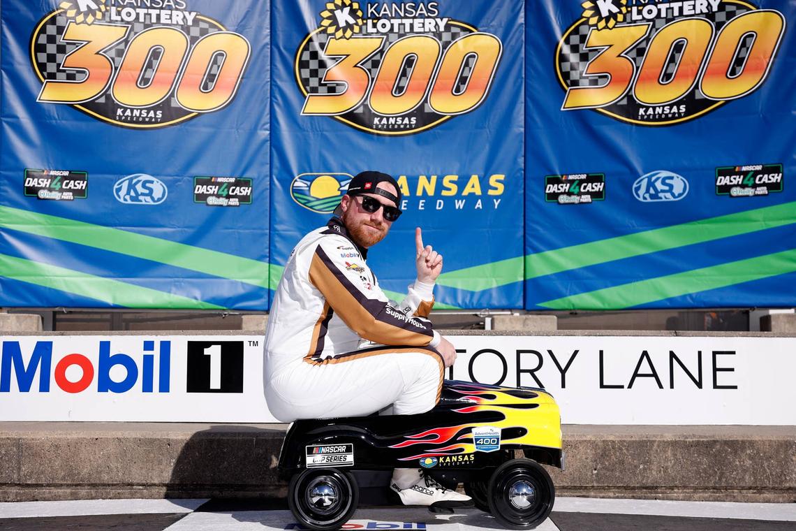  Tyler Reddick rides on the pedal car after winning the pole award at Kansas Speedway. (Photo by Sean Gardner/Getty Images)