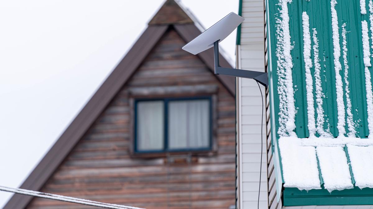 A Starlink satellite internet antenna sits outside a house on Wednesday, May 17, 2023 in Bethel, Alaska. (Loren Holmes/Anchorage Daily News/TNS)