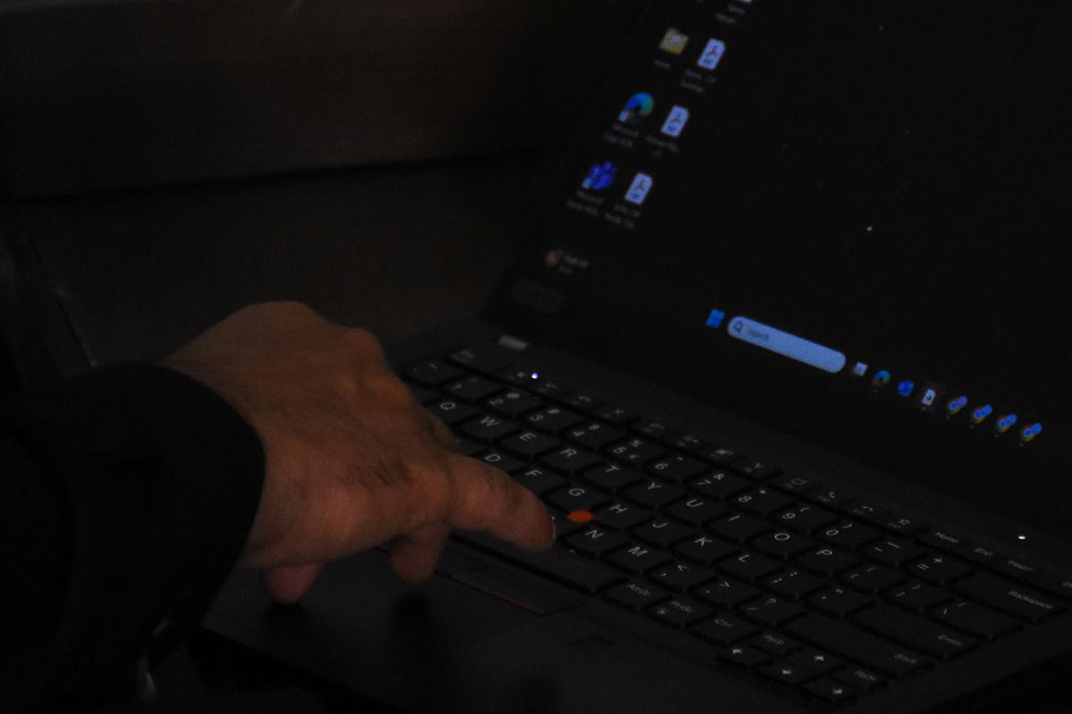 A 38-year-old Shi'ite Muslim, former Dubai Metro manager, who was deported after 16 years in the United Arab Emirates, along with many others following the U.S.-Israeli war against Iran, works on his computer in Chakwal, Pakistan, May 5, 2026. REUTERS/Waseem Khan