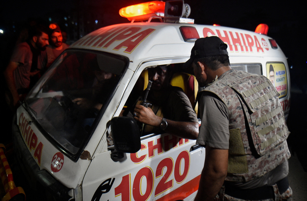 An ambulance carrying the body of a victim leaves after an explosion and gunfire were reported, near offices of the Rangers, a paramilitary force, in Karachi, Pakistan, June 27, 2026. REUTERS/Qaiser Khan