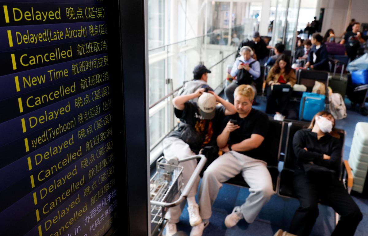 Passengers wait for delayed flights as Tropical Storm Jangmi hits across Japan at Haneda Airport in Tokyo, Japan, June 3, 2026. REUTERS/Kim Kyung-Hoon