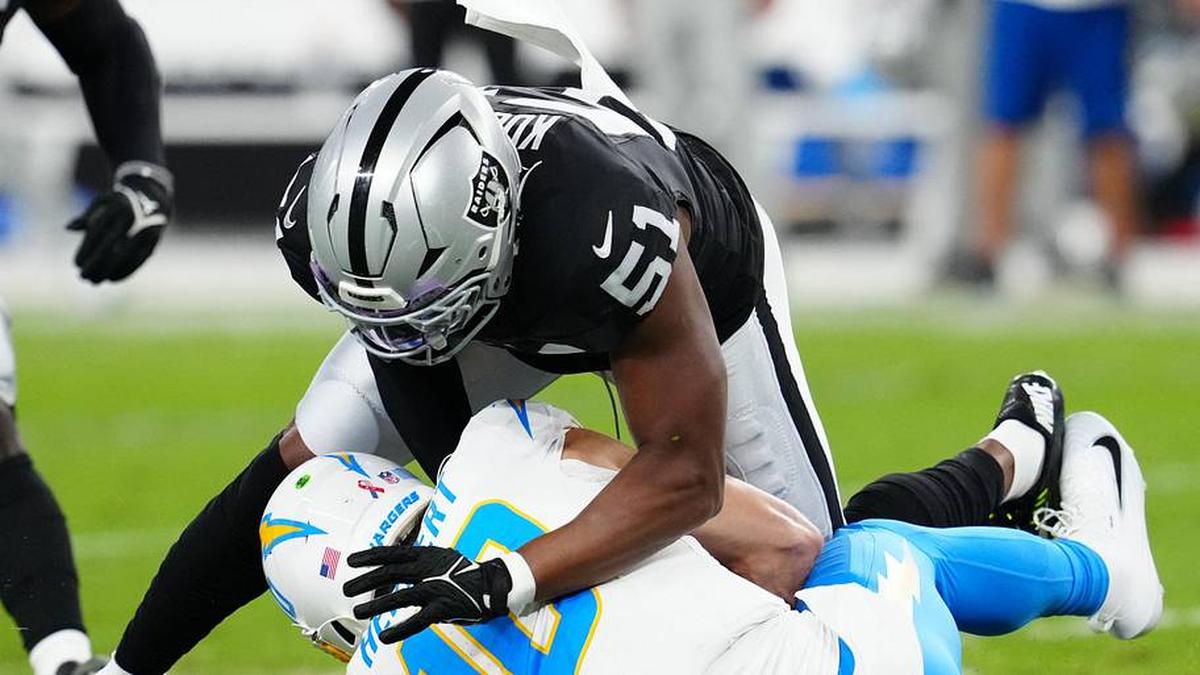  Sep 15, 2025; Paradise, Nevada, USA; Las Vegas Raiders defensive end Malcolm Koonce (51) sacks Los Angeles Chargers quarterback Justin Herbert (10) during the first quarter at Allegiant Stadium. Mandatory Credit: Stephen R. Sylvanie-Imagn Images | Stephen R. Sylvanie-Imagn Images 