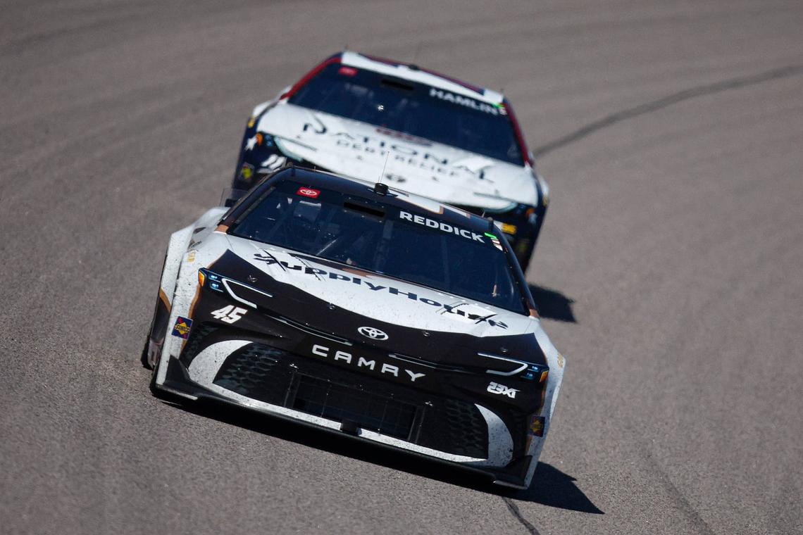  Tyler Reddick races away from Denny Hamlin at Kansas Speedway. (Photo by Sean Gardner/Getty Images)