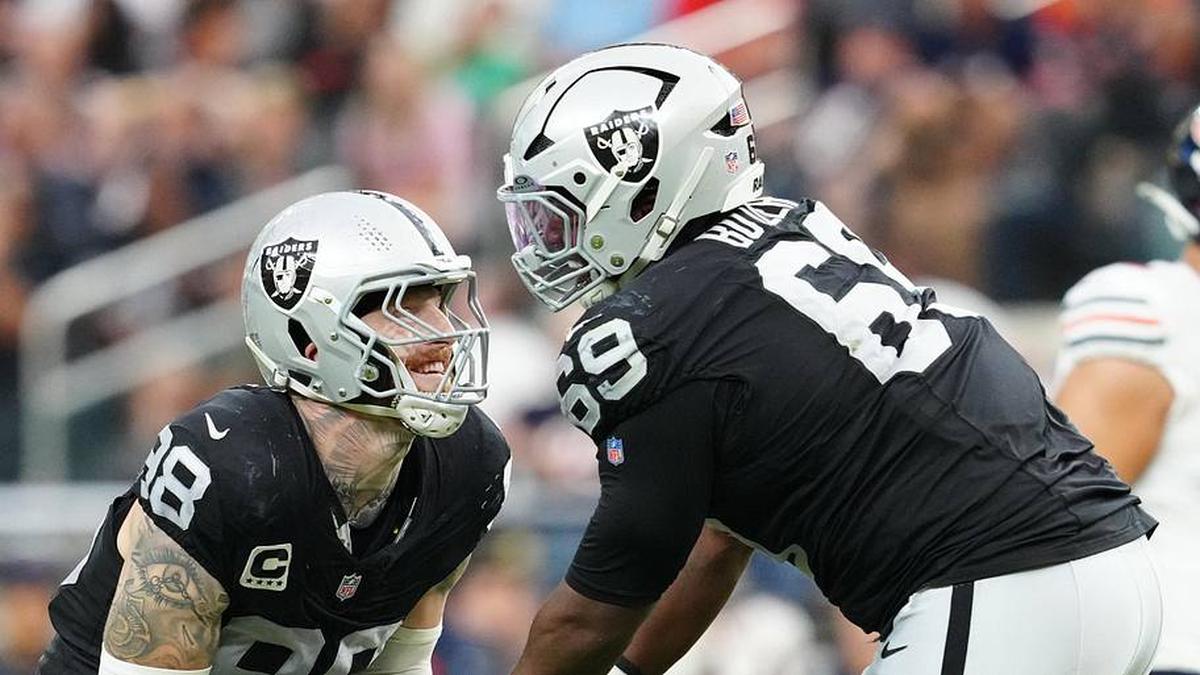  Sep 28, 2025; Paradise, Nevada, USA; Las Vegas Raiders defensive end Maxx Crosby (98) celebrates a play with defensive tackle Adam Butler (69) during the second half against the Chicago Bears at Allegiant Stadium. Mandatory Credit: Stephen R. Sylvanie-Imagn Images | Stephen R. Sylvanie-Imagn Images 