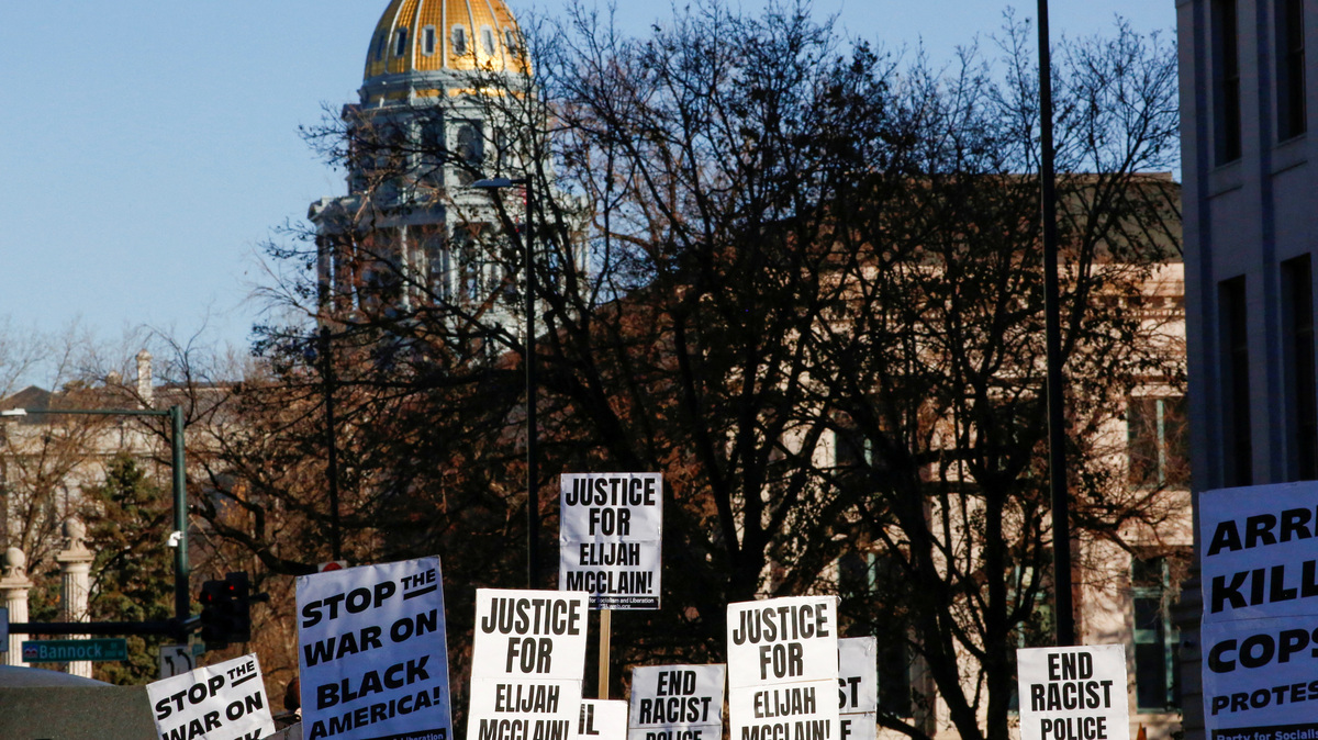 FILE PHOTO: Protesters march to call for justice for Elijah McClain after Governor Jared Polis amended his executive order regarding the investigation of McClain's death, which has raised concerns that charges against the police officers involved may ultimately be watered down, in Denver, Colorado, U.S., November 21, 2020.  REUTERS/Kevin Mohatt/File Photo
