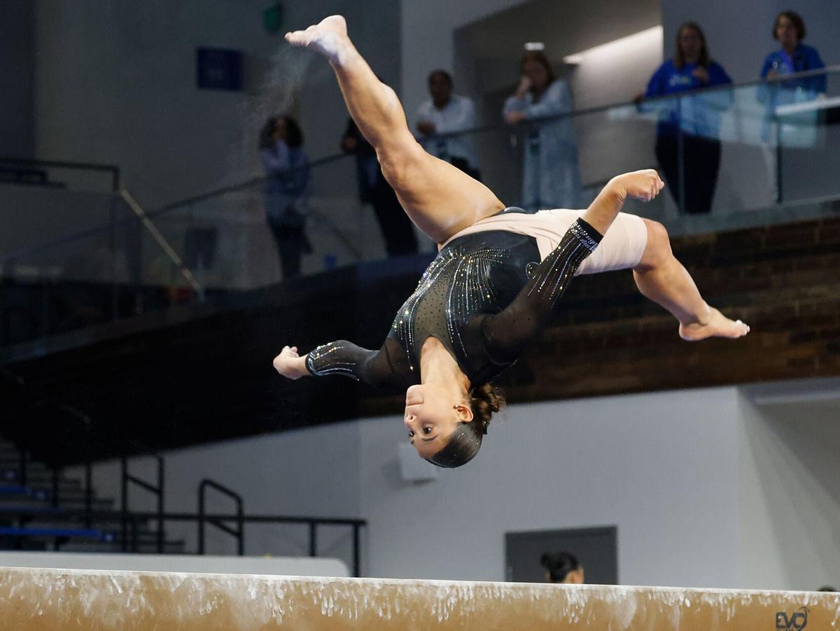 Amy Wier does a front aerial on beam at the NCAA Lexington Regional on Friday at the Historic Memorial Coliseum in Lexington, Ky. The Tigers earned a 48.950 on beam as a team total.