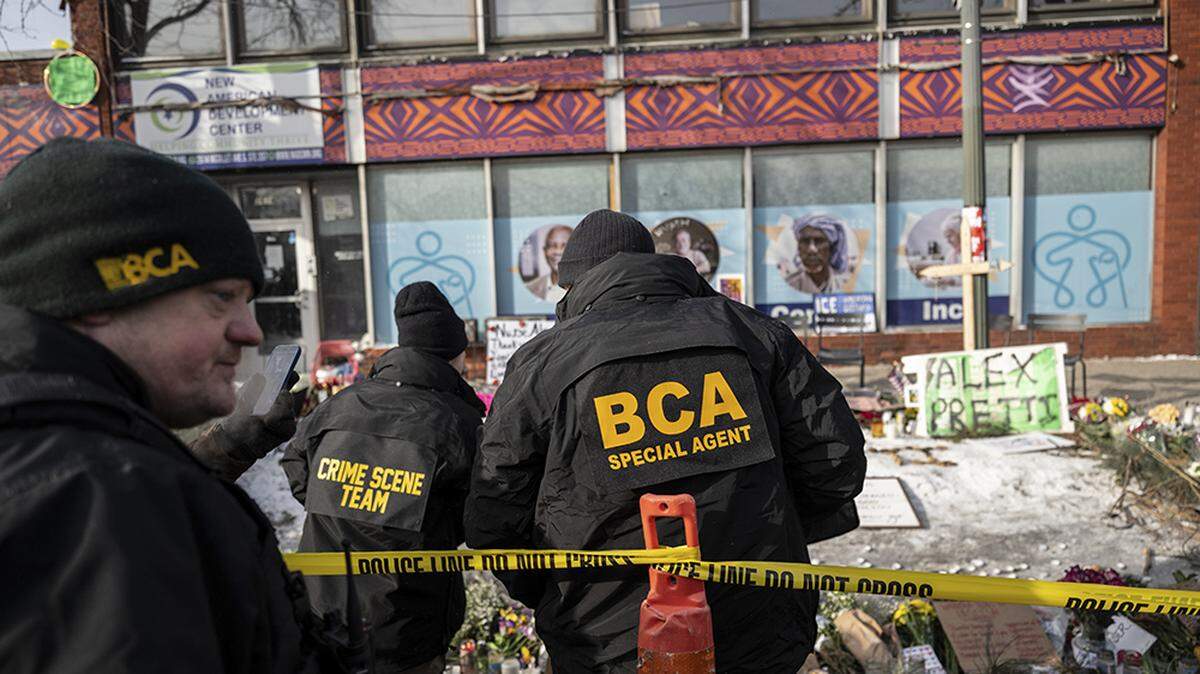 Investigators from the Minnesota Bureau of Criminal Apprehension visit the site in Minneapolis where Alex Pretti was shot and killed by federal immigration agents on Sunday.