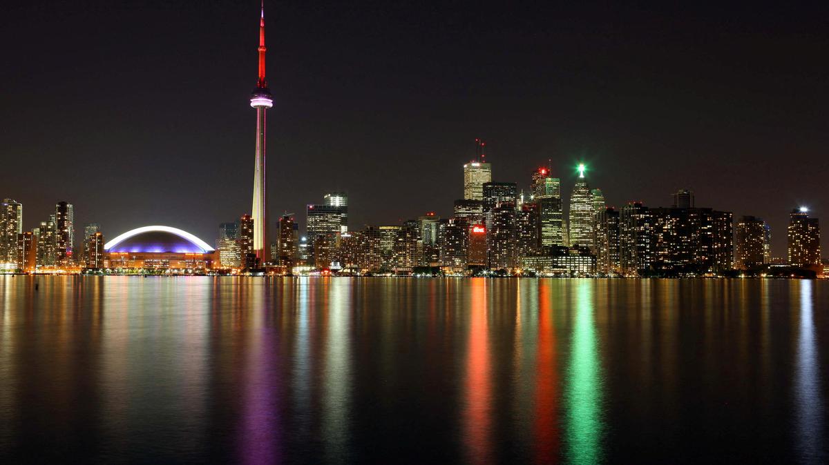June 24, 2009; Toronto, ON, Canada; A view of the Rogers Centre next to the CN Tower and the rest of the Toronto skyline as seen across Lake Ontario. Mandatory Credit: Tom Szczerbowski-US PRESSWIRE
