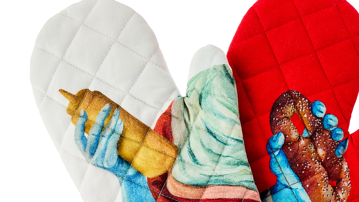 Sheila Bridges designed oven mitts with an image of a soft pretzel, part of The Philadelphia Collection sold at walmart. (Walmart/TNS)