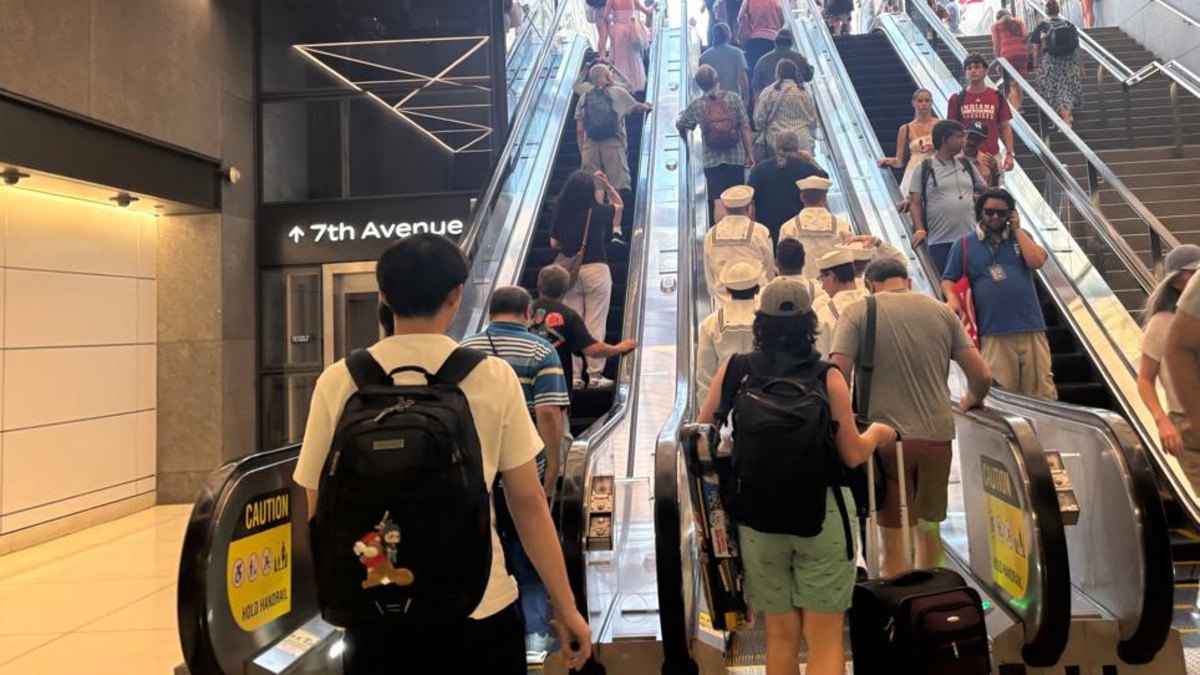 Tourists bustle in and out of Penn Station in New York on Friday, July 3, as they arrive in the city for Fourth of July festivities and possibly a Taylor Swift wedding.