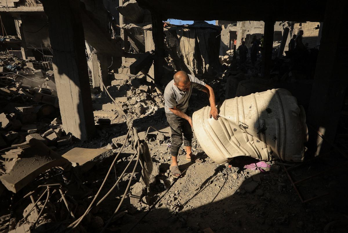 A Palestinian man works at the site of an Israeli strike on a house, which was pre-warned by the Israeli military to evacuate before the strike was carried out late on Thursday, at Shati (Beach) refugee camp in Gaza City, May 29, 2026. REUTERS/Dawoud Abu Alkas