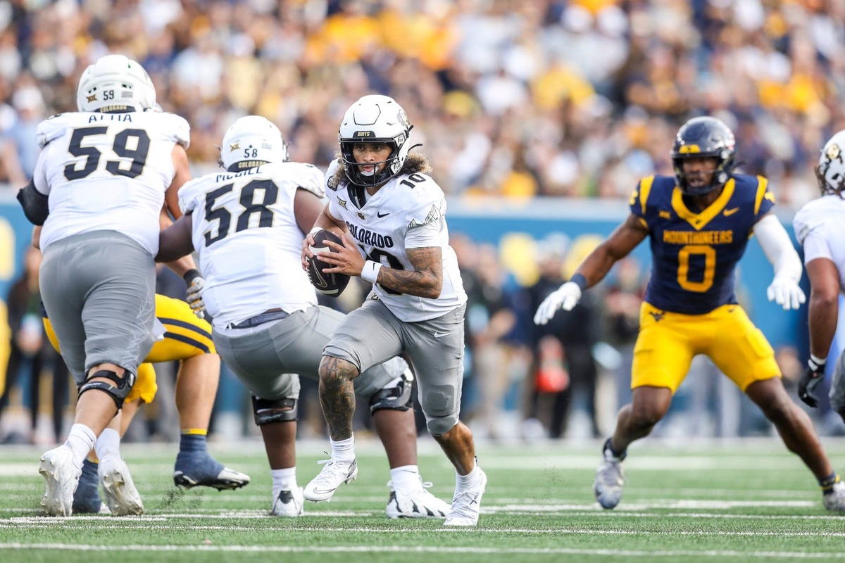  Nov 8, 2025; Morgantown, West Virginia, USA; Colorado Buffaloes quarterback Julian Lewis (10) runs out of the pocket during the third quarter against the West Virginia Mountaineers at Milan Puskar Stadium. Mandatory Credit: Ben Queen-Imagn Images 