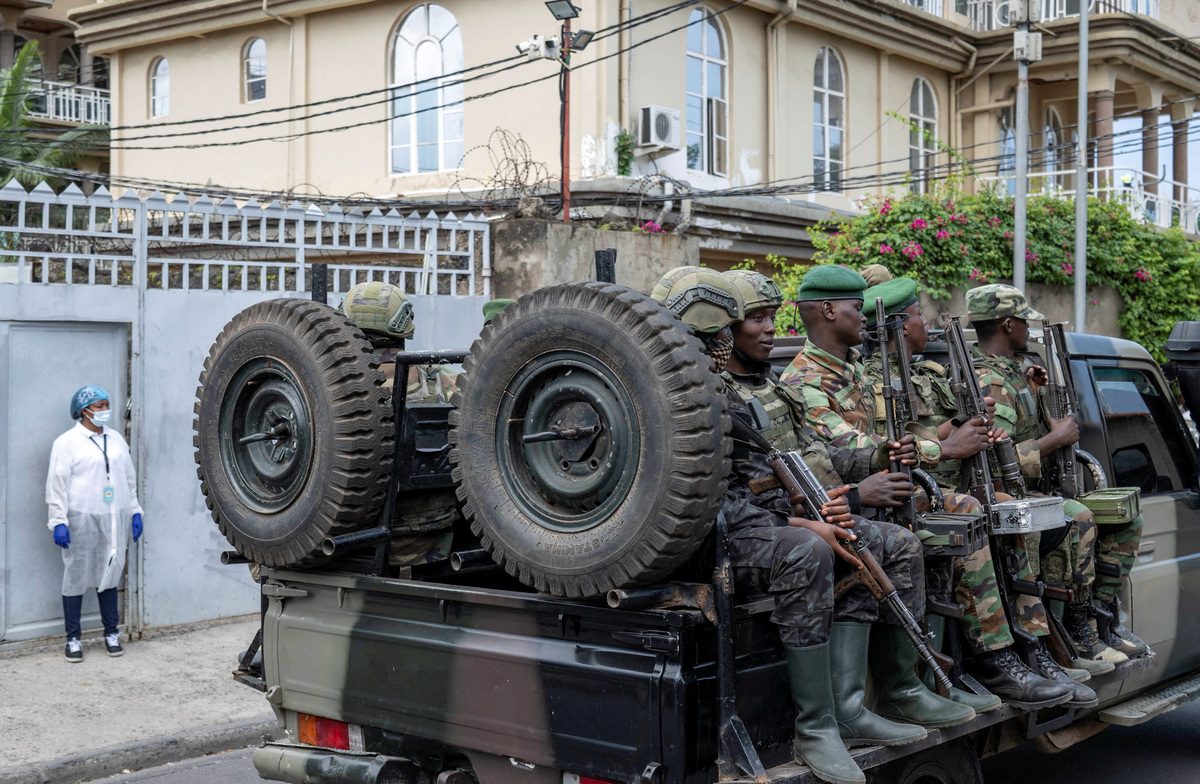 FILE PHOTO: Members of the M23 rebel group ride on a pickup truck as they leave the laboratory after provincial authorities visited the Rodolphe Merieux Laboratory, National Biomedical Research Institute (INRB), where samples from suspected Ebola cases are tested, as part of the response to the epidemic in Goma, North Kivu province of the Democratic Republic of Congo, May 19, 2026. REUTERS/Arlette Bashizi/File Photo