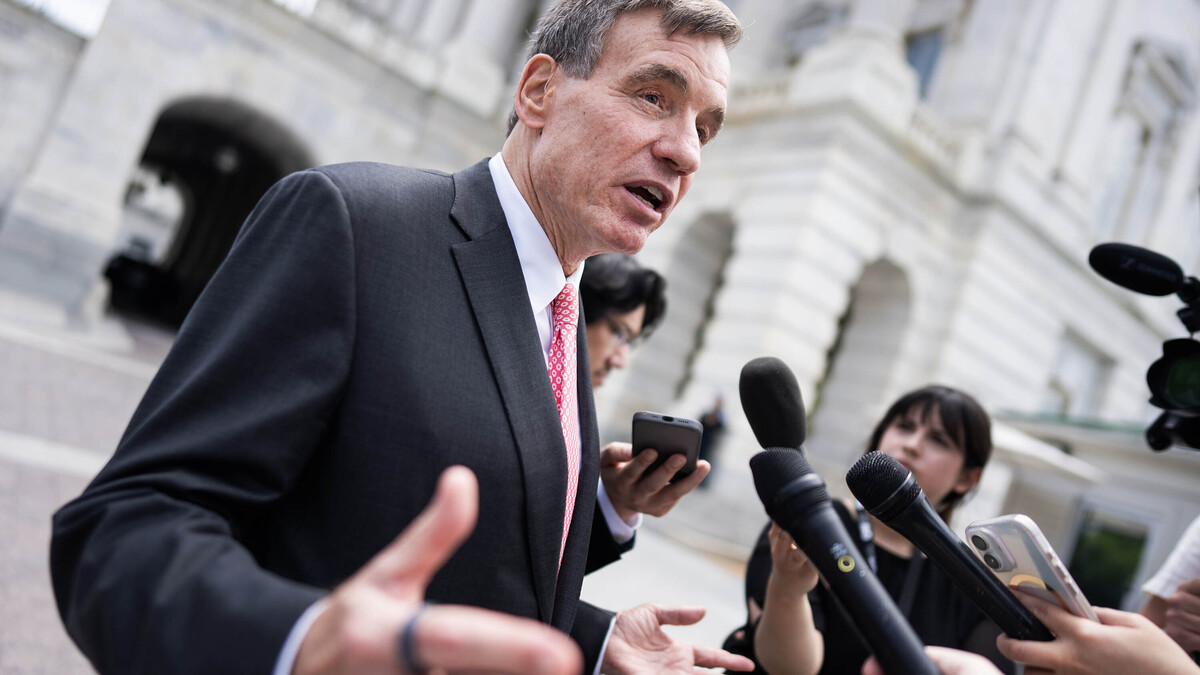 Sen. Mark Warner (D-VA) talks with reporters outside the U.S. Capitol on June 9, 2026. (Tom Williams/CQ Roll Call/Zuma Press/TNS)