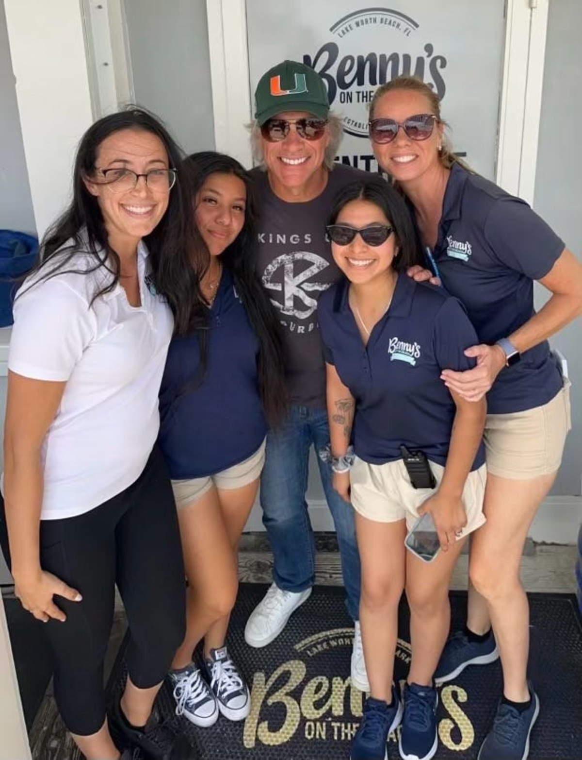 Rock star Jon Bon Jovi poses for a photo with Benny's on the Beach employees during a visit to the waterfront restaurant in Lake Worth Beach Monday, March 13, 2023.