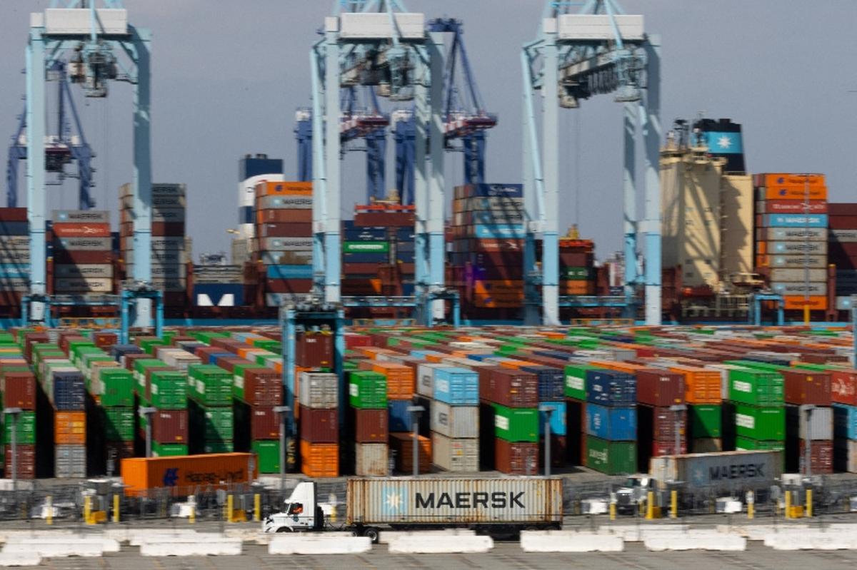 A truck carries a Maersk container at APM Terminals at the Port of Los Angeles, California, U.S., March 4, 2026.   REUTERS/Mike Blake