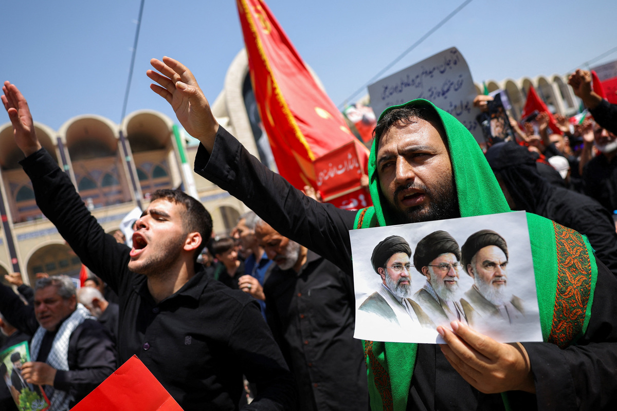 People attend a public farewell ceremony to pay their respects to late Supreme Leader Ayatollah Ali Khamenei, who was killed on February 28 in Israeli and U.S. airstrikes, at the Imam Khomeini Grand Mosalla, in Tehran, Iran July 4, 2026.  REUTERS/Murad Sezer  Foreign media in Iran operate under guidelines set by the Ministry of Culture and Islamic Guidance, which regulates press activity and permissions