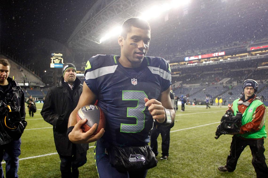  Seattle Seahawks quarterback Russell Wilson jogs off the field following a win over the San Francisco 49ers at CenturyLink Field. Joe Nicholson-USA TODAY Sports via Imagn Images