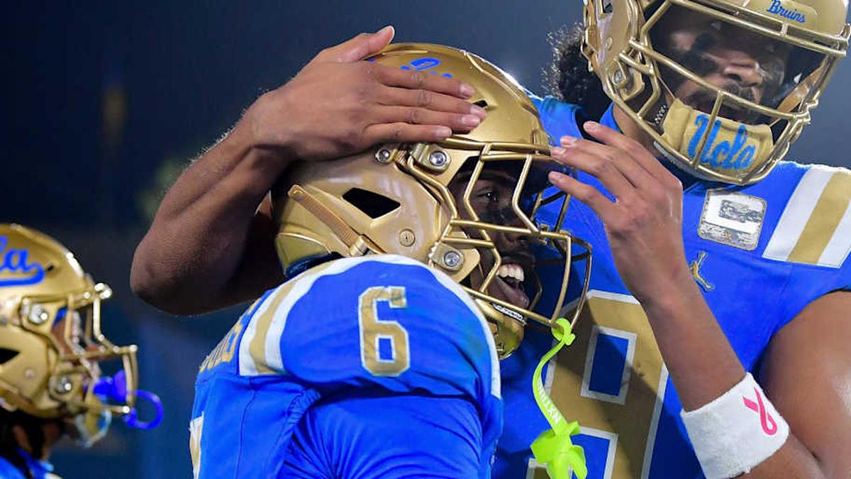  Nov 8, 2025; Pasadena, California, USA; UCLA Bruins running back Anthony Woods (6) celebrates his touchdown scored against the Nebraska Cornhuskers with quarterback Nico Iamaleava (9) during the second half at the Rose Bowl. Mandatory Credit: Gary A. Vasquez-Imagn Images | Gary A. Vasquez-Imagn Images 