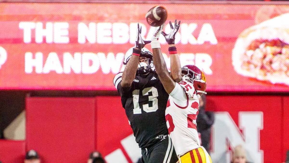  Nov 1, 2025; Lincoln, Nebraska, USA; Southern California Trojans cornerback Marcelles Williams (25) breaks up a pass to Nebraska Cornhuskers wide receiver Nyziah Hunter (13) during the fourth quarter at Memorial Stadium. Mandatory Credit: Dylan Widger-Imagn Images | IMAGN IMAGES via Reuters Connect 