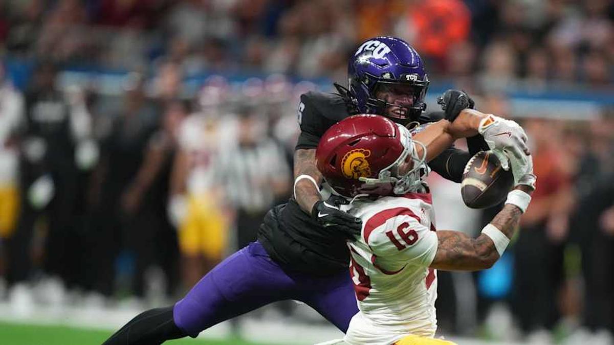  Dec 30, 2025; San Antonio, TX, USA; Southern California Trojans wide receiver Tanook Hines (16) catches the ball against TCU Horned Frogs cornerback Vernon Glover (26) in the second half during the Alamo Bowl at Alamodome. Mandatory Credit: Kirby Lee-Imagn Images | Kirby Lee-Imagn Images 