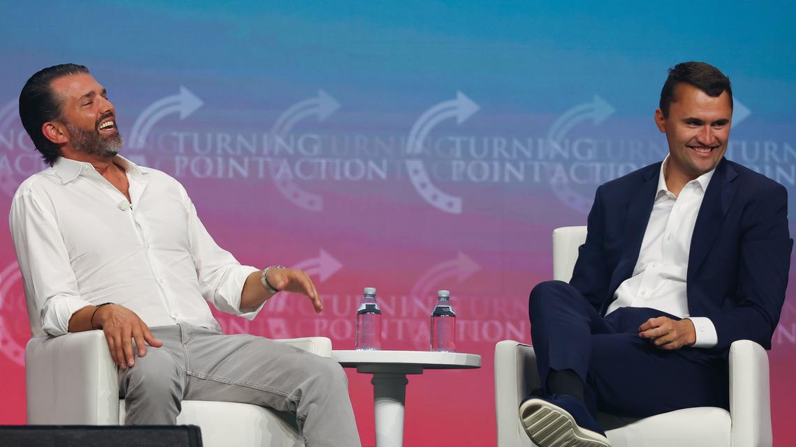 Donald Trump Jr. and Charlie Kirk speak on stage during day one of the Turning Point USA Student Action Summit on Friday, July 11, 2025, in Tampa, Florida. Kirk was shot and killed Wednesday, Sept. 10, at an appearance in Utah.