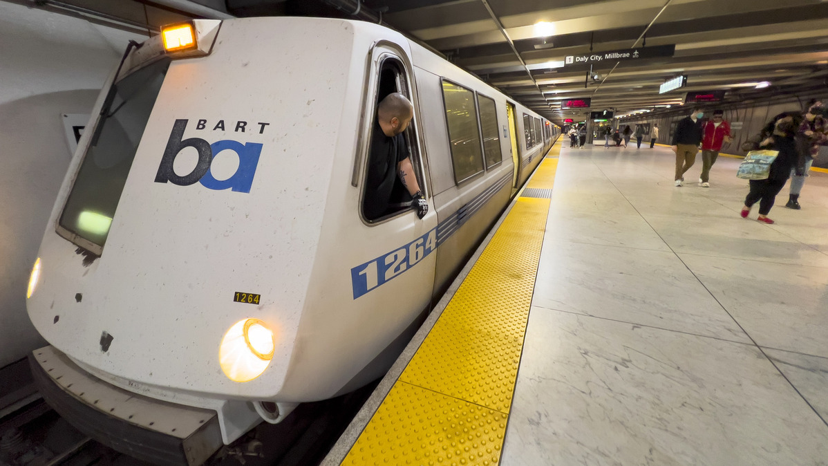 A BART train operator waits for passengers to finish board at the Embarcadero station in San Francisco on Friday, April 1, 2022. (Jose Carlos Fajardo/Bay Area News Group)